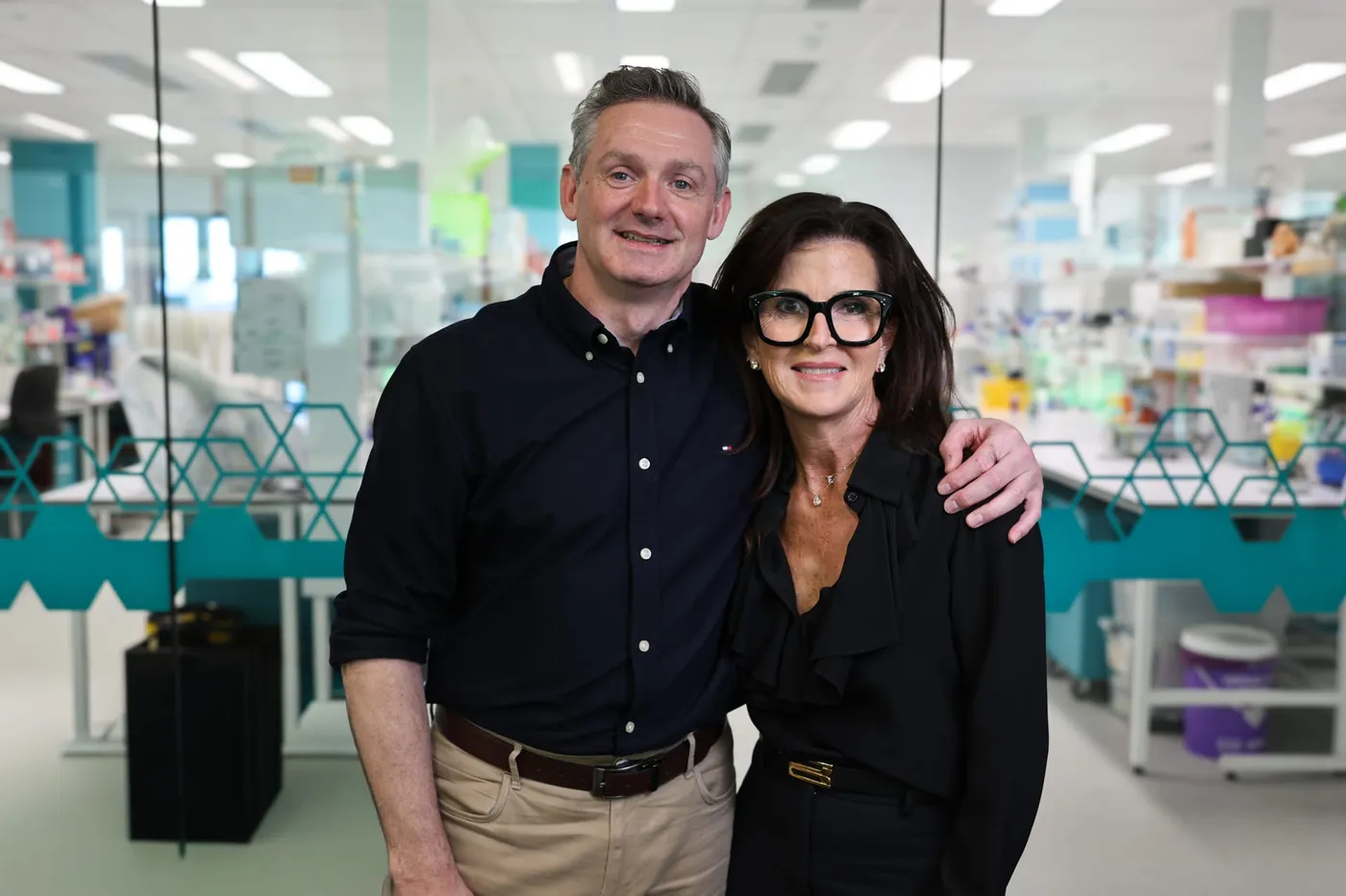 Nick Gottardo and Elizabeth Perron in front of cancer labs.