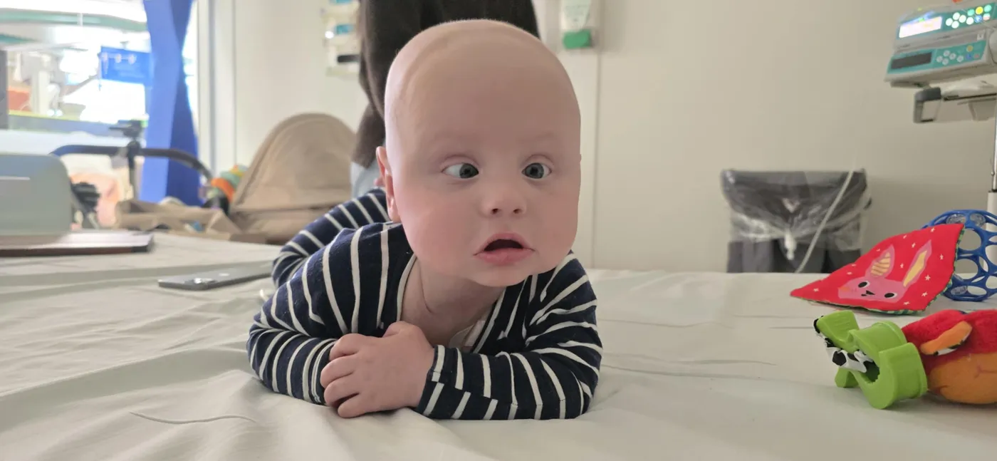 A baby on a hospital bed